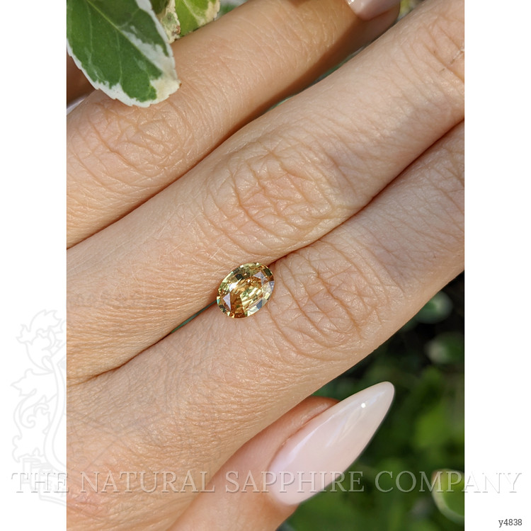 0.97 Ct. Orangish Yellow Sapphire from Ceylon (Sri Lanka)